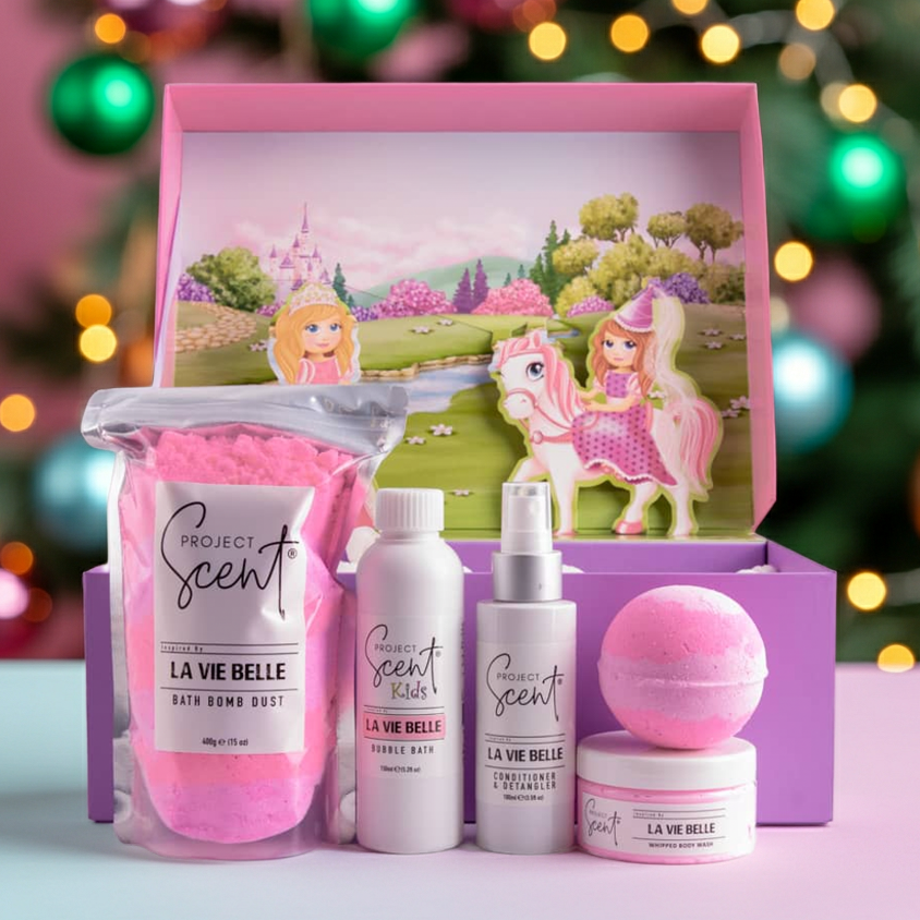 Set of Project Scents products in a decorative box with a Christmas tree in the background