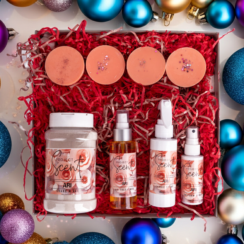 Set of beauty products in a decorative box surrounded by colorful ornaments