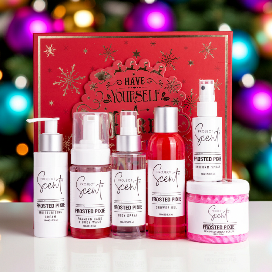 Project Scent Frosted Pixie Shower products with a red christmas box against a Christmas background