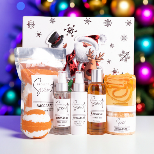 Bath and body products with decorative packaging in front of a festive background