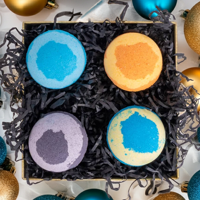 Box of bath bombs with decorative ornaments on a white background