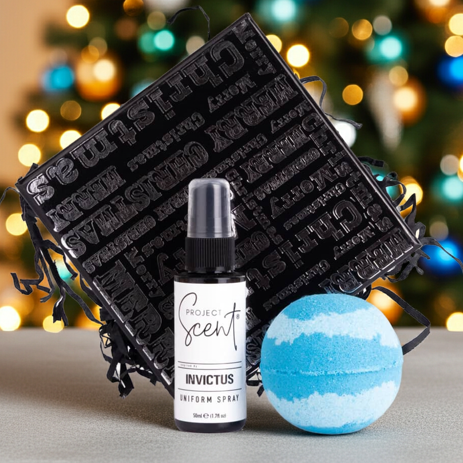 Project Scent Invictus uniform spray bottle and bath bomb with black packaging against a festive background.