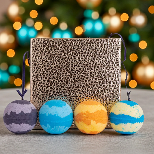 Colourful bath bombs with a gift box against a christmas backdrop