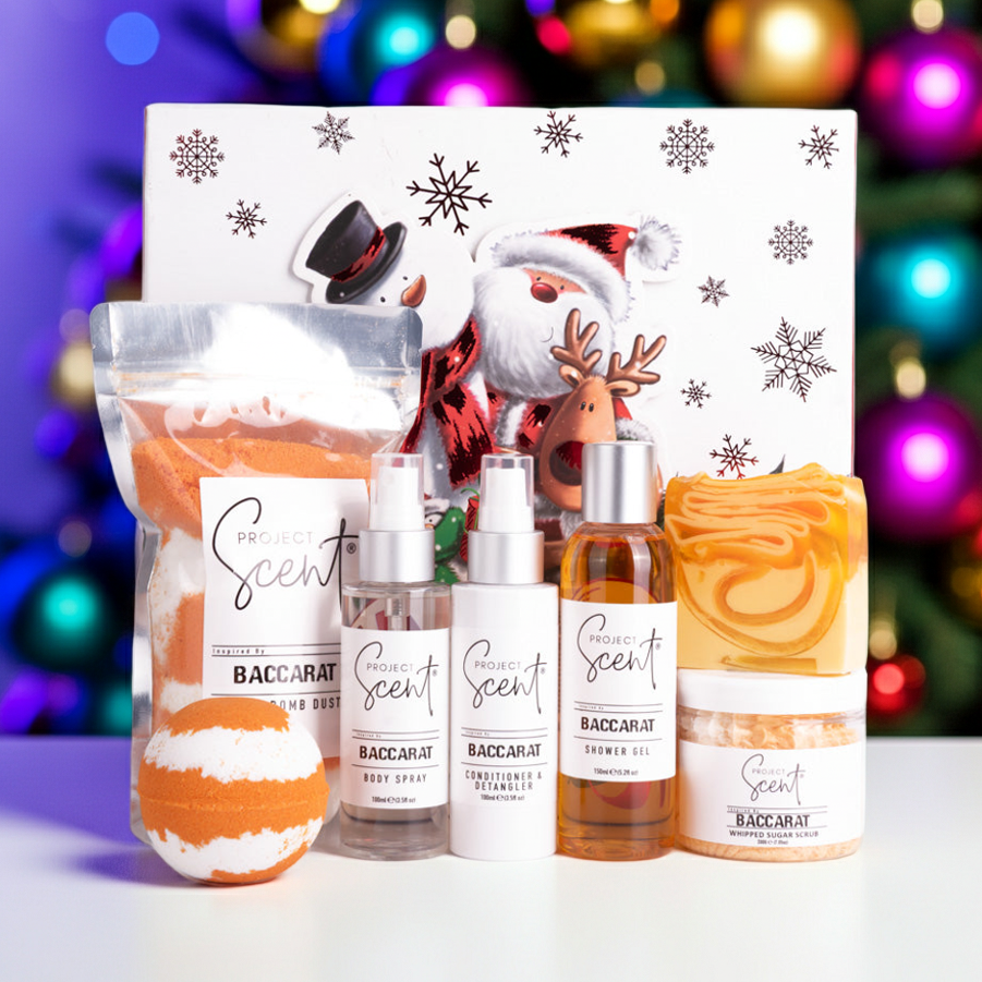 Bath and body products with decorative packaging in front of a festive background
