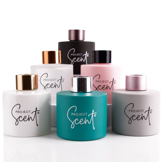 Selection of coloured reed diffuser bottles and caps