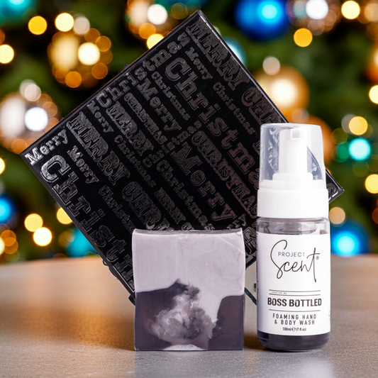 Product display with 'Boss Bottled' soap and bottle against a festive background