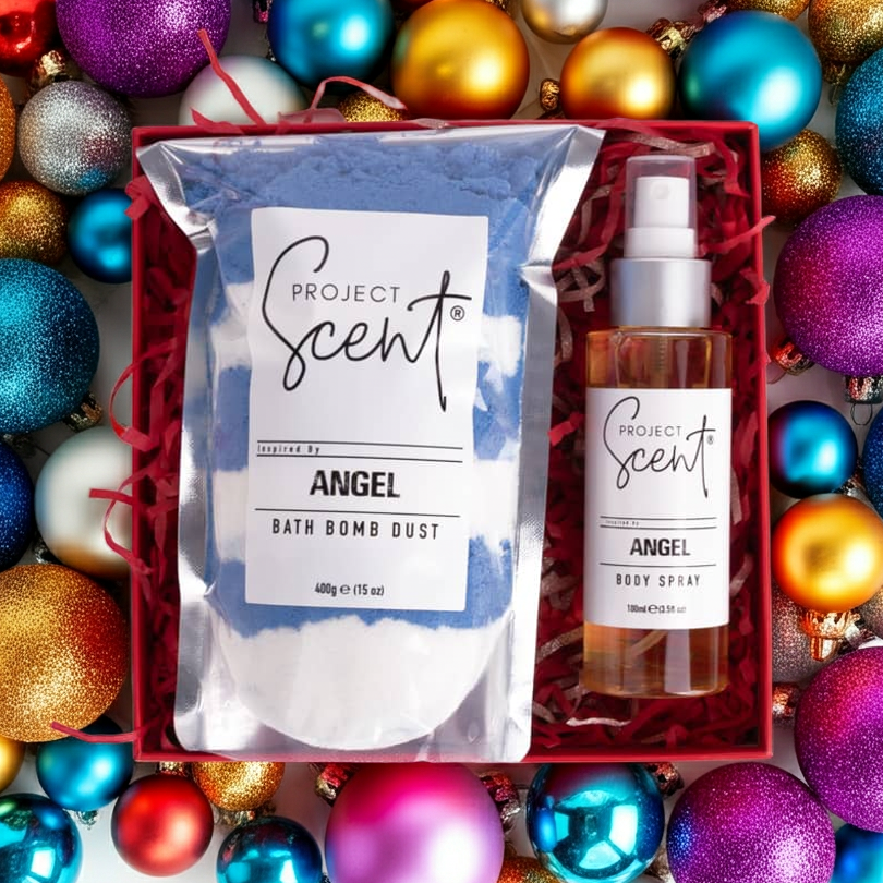 Flatlay of Christmas bath and body gift set surrounded by festive decorations. Features handmade bath dust and body spray gift box.